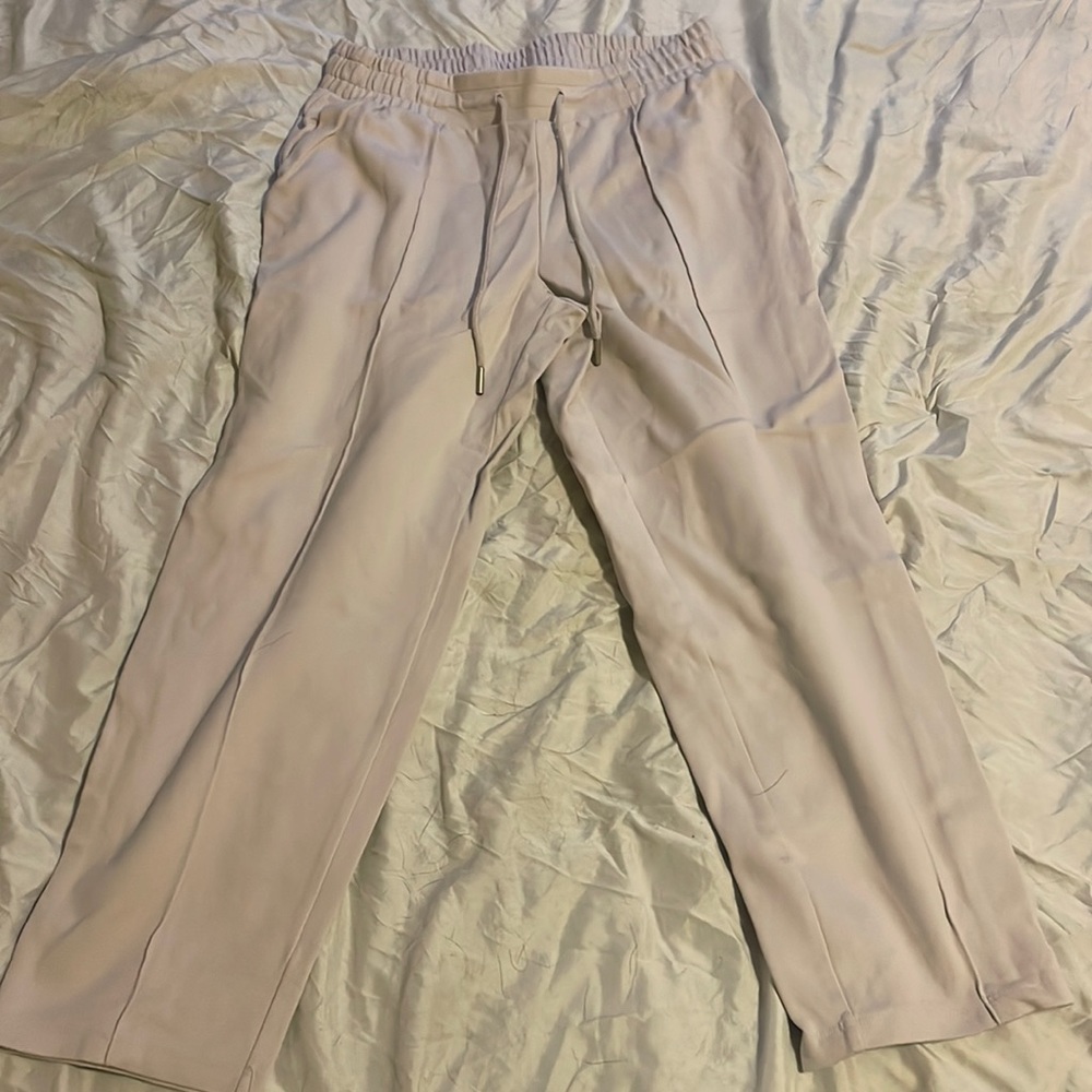 Grey drawstring work pants.